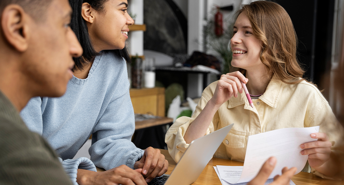 Young couple discussing guarantor home loan options with a mortgage broker in Baldivis office